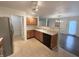 Well-lit kitchen featuring wood cabinets, a white sink, and a black dishwasher at 14243 Clapboard Dr, Noblesville, IN 46060
