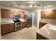 Well-equipped kitchen with stainless steel appliances, and ample cabinet space at 14243 Clapboard Dr, Noblesville, IN 46060
