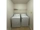 Convenient laundry room featuring a washer, dryer, and overhead shelving for optimal storage at 14243 Clapboard Dr, Noblesville, IN 46060