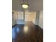 Spacious living room with hard wood floors, neutral walls, and view of the dining area at 14243 Clapboard Dr, Noblesville, IN 46060