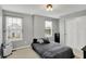 Cozy bedroom with neutral walls, two windows, a comfortable bed, and a spacious closet at 146 Handley St, Indianapolis, IN 46222