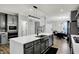 Modern kitchen with stainless steel appliances and quartz countertops on a large kitchen island at 146 Handley St, Indianapolis, IN 46222