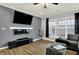 Bright living room with a modern fireplace, large television, and a comfortable sectional sofa at 146 Handley St, Indianapolis, IN 46222