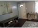 Inviting entryway with a decorative table, artwork, and stylish rug at 150 E Carlisle St, Mooresville, IN 46158