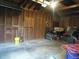 Spacious unfinished garage with wood framing and concrete floor, offering ample storage space at 150 E Carlisle St, Mooresville, IN 46158
