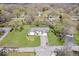 Aerial view of home with a long driveway and manicured lawn at 1520 E 87Th St, Indianapolis, IN 46240