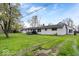 Large backyard with a deck and healthy green grass at 1520 E 87Th St, Indianapolis, IN 46240