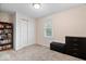 Bedroom features a built-in bookshelf, neutral walls, and a double door closet at 1520 E 87Th St, Indianapolis, IN 46240
