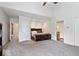 Bright bedroom boasting high ceilings and carpet that enhances the natural light at 1520 E 87Th St, Indianapolis, IN 46240