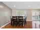 Dining room featuring hardwood floors, neutral decor, and a view of the backyard at 1520 E 87Th St, Indianapolis, IN 46240