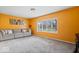 Cozy living room with natural light and neutral colored sofa at 1520 E 87Th St, Indianapolis, IN 46240