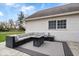 Relaxing patio with comfortable outdoor sectional seating and firepit table at 1520 E 87Th St, Indianapolis, IN 46240
