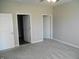 An additional view of this spacious bedroom, featuring a ceiling fan and multiple doors at 1615 Capra Ct, Beech Grove, IN 46107