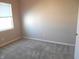 Cozy bedroom with plush carpet, a window, and ample natural light at 1615 Capra Ct, Beech Grove, IN 46107