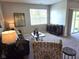Inviting living room with a sliding glass door, plush carpet, and comfortable seating at 1615 Capra Ct, Beech Grove, IN 46107