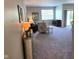 Open-concept living area with neutral tones, comfortable seating, and ample natural light at 1615 Capra Ct, Beech Grove, IN 46107