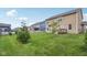 Beautiful backyard with a lush lawn, mature trees, and a charming fence at 16491 Wheatley Ct, Fishers, IN 46040