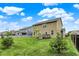 A spacious backyard features a wooden deck, green grass, and a black fence, perfect for outdoor enjoyment at 16491 Wheatley Ct, Fishers, IN 46040