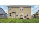 Spacious backyard featuring a well-maintained lawn, deck, and exterior view of the house at 16491 Wheatley Ct, Fishers, IN 46040
