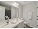 Clean bathroom with a single vanity and a large mirror, plus decorative floral arrangement at 16491 Wheatley Ct, Fishers, IN 46040