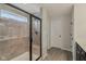 Modern bathroom with a glass-enclosed shower, tiled walls, a window, and neutral flooring at 16491 Wheatley Ct, Fishers, IN 46040