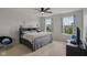 Bedroom with a queen bed, two large windows, and a ceiling fan at 16491 Wheatley Ct, Fishers, IN 46040