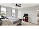 Bedroom with a black ceiling fan, a storage cube, and windows with patterned curtains at 16491 Wheatley Ct, Fishers, IN 46040