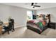 Bedroom with a black ceiling fan, a desk with a rolling chair, and a bed with storage at 16491 Wheatley Ct, Fishers, IN 46040