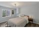 Bedroom with a bed, two nightstands with lamps, and a small window bringing natural light at 16491 Wheatley Ct, Fishers, IN 46040