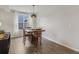 Cozy dining area with a wooden table, pendant lighting, and a large window at 16491 Wheatley Ct, Fishers, IN 46040