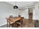 Cozy dining area with wood floors and modern lighting, great for Gathering meals at 16491 Wheatley Ct, Fishers, IN 46040