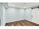 Finished basement with modern flooring and a white barn door, offering a versatile and stylish space at 16491 Wheatley Ct, Fishers, IN 46040
