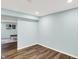 Bright and airy finished basement room, ready for customization, with wood-look floors at 16491 Wheatley Ct, Fishers, IN 46040