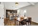 A well lit modern kitchen with stainless steel appliances, a breakfast bar, and a dining area at 16491 Wheatley Ct, Fishers, IN 46040