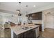 Modern kitchen with granite countertops, stainless steel appliances, and an island with sink at 16491 Wheatley Ct, Fishers, IN 46040