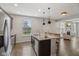 Bright kitchen featuring stainless steel appliances, granite countertops, and an island with bar seating at 16491 Wheatley Ct, Fishers, IN 46040