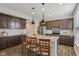 Modern kitchen with granite countertops, stainless steel appliances, and a large island at 16491 Wheatley Ct, Fishers, IN 46040