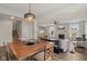 Spacious living area with hardwood floors, dining space, and fireplace, ideal for entertaining at 16491 Wheatley Ct, Fishers, IN 46040