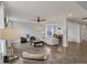 Open-concept living space with hardwood floors, neutral decor, and views into the dining area at 16491 Wheatley Ct, Fishers, IN 46040