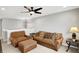Comfortable living room with plush seating and a ceiling fan at 16491 Wheatley Ct, Fishers, IN 46040
