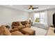 Inviting living room with large windows and comfortable seating at 16491 Wheatley Ct, Fishers, IN 46040