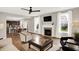 An inviting living room with a fireplace that is open to the kitchen and dining area at 16491 Wheatley Ct, Fishers, IN 46040
