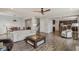 Open-concept living space featuring hardwood floors, a dining area, and modern furnishings at 16491 Wheatley Ct, Fishers, IN 46040