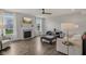Bright living room featuring a fireplace, hardwood floors, and modern furnishings at 16491 Wheatley Ct, Fishers, IN 46040