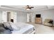 Cozy primary bedroom with tray ceiling and ensuite bathroom access at 16491 Wheatley Ct, Fishers, IN 46040