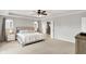 Bright primary bedroom with tray ceiling and ensuite bathroom at 16491 Wheatley Ct, Fishers, IN 46040