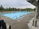 Community pool offers a refreshing retreat with clear blue water, lounge chairs, and easy access stairs at 16491 Wheatley Ct, Fishers, IN 46040