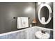 Stylish powder room with updated fixtures and decor at 16491 Wheatley Ct, Fishers, IN 46040