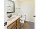 Cozy bathroom with tile floors, wooden cabinet, and granite countertops at 170 Straughn Ln, Westfield, IN 46074