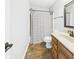 Bathroom featuring a shower with a striped curtain, toilet, mirror, and a vanity with tile floors at 170 Straughn Ln, Westfield, IN 46074